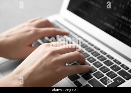 Programmer using laptop, closeup Stock Photo