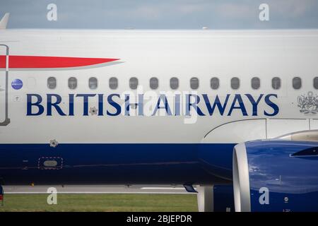 Glasgow, UK. 28 April 2020.   Pictured: A British Airways flight from London Heathrow arrives in Glasgow, which is one of only a handful of scheduled flights into Glasgow today during the Coronavirus (COVID-19) crisis UK extended lockdown.  To date British Airways has made an announcement which sees almost 12,000 staff axed reacting to the pandemic which has hit every major airline, putting some out of business. Credit: Colin Fisher/Alamy Live News. Stock Photo