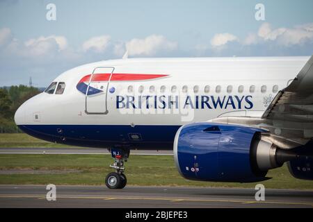 Glasgow, UK. 28 April 2020.   Pictured: A British Airways flight from London Heathrow arrives in Glasgow, which is one of only a handful of scheduled flights into Glasgow today during the Coronavirus (COVID-19) crisis UK extended lockdown.  To date British Airways has made an announcement which sees almost 12,000 staff axed reacting to the pandemic which has hit every major airline, putting some out of business. Credit: Colin Fisher/Alamy Live News. Stock Photo