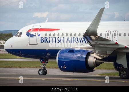 Glasgow, UK. 28 April 2020.   Pictured: A British Airways flight from London Heathrow arrives in Glasgow, which is one of only a handful of scheduled flights into Glasgow today during the Coronavirus (COVID-19) crisis UK extended lockdown.  To date British Airways has made an announcement which sees almost 12,000 staff axed reacting to the pandemic which has hit every major airline, putting some out of business. Credit: Colin Fisher/Alamy Live News. Stock Photo