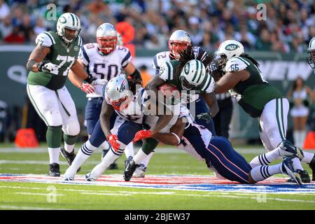 October 20, 2013: j3 is tackled by New England Patriots outside linebacker Dont'a Hightower (54) and New England Patriots middle linebacker Brandon Stock Photo