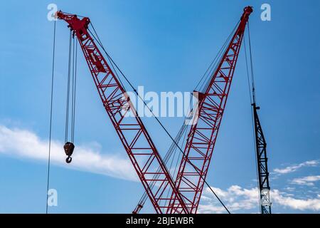 Detroit, Michigan - Two cranes used in reconstructing a bridge over Interstate 94. Stock Photo