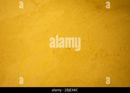 Golden yellow stone marble surface backdrop Stock Photo