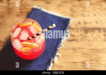 Refreshing cocktail with grapefruit on wooden table Stock Photo