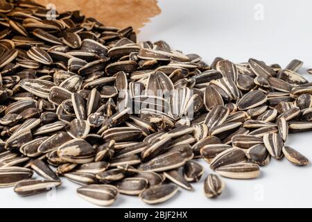 Large striped sunflower seeds with shell texture background Stock Photo