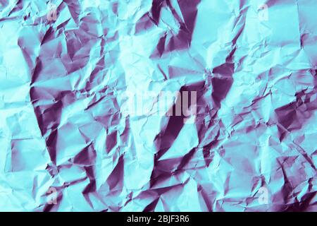 A crumpled paper background. Bright purple and blue colors. Stock Photo