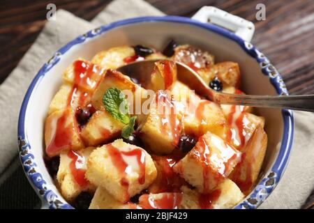 Delicious bread pudding with currant and jam in bowl Stock Photo
