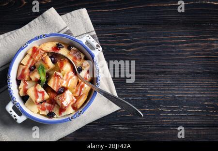 Delicious bread pudding with currant and jam in bowl Stock Photo