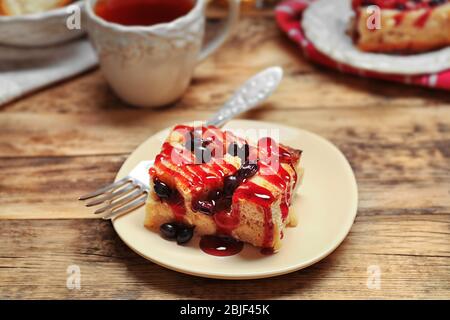 Delicious bread pudding with currant and jam on plate Stock Photo