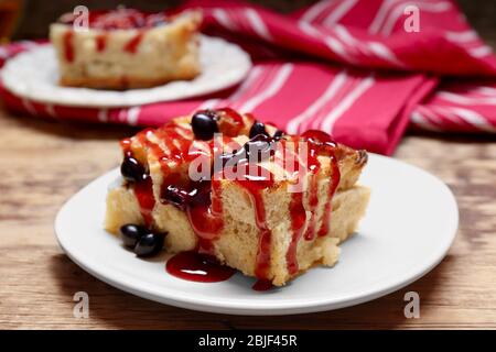 Delicious bread pudding with currant and jam on plate Stock Photo