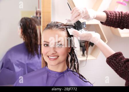 Process of dyeing hair at beauty salon Stock Photo