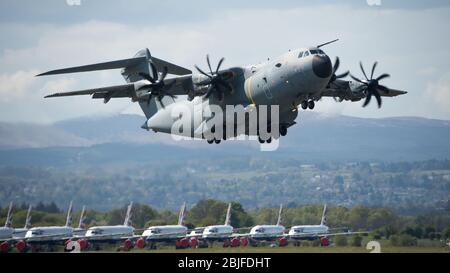 Glasgow, UK. 28th Apr, 2020. Pictured: Royal Air Force flight operating their new Airbus 400B Aircraft seen landing and taking off at Glasgow International Airport during the Coronavirus (COVID19) extended lockdown. The RAF’s new Airbus aircraft have replaced the ageing Hercules C130 Aircraft which have been the work horse for the RAF for decades. Credit: Colin Fisher/Alamy Live News. Stock Photo