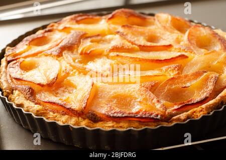 Close up French cuisine pear tart preparation Stock Photo