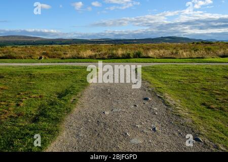 Concept of choice & decision making: footpath at Culloden forks left and right and is pictured on a sunny day with a blue sky Stock Photo