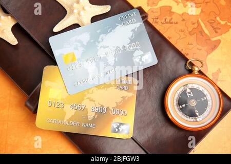 Credit cards with wallet on world map background Stock Photo