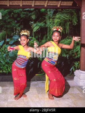 Young female Legong Balinese dancers, Denpasar, Bali, Indonesia Stock Photo