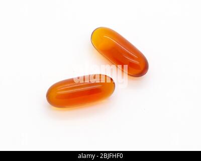 Close Up Of Two Isolated Capsules On A White Background, London, England Stock Photo