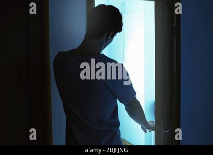Young sleepy man suffering from somnambulism at home Stock Photo