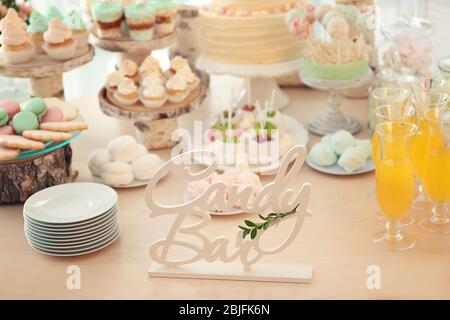 Wooden decor on table with sweets prepared for party Stock Photo