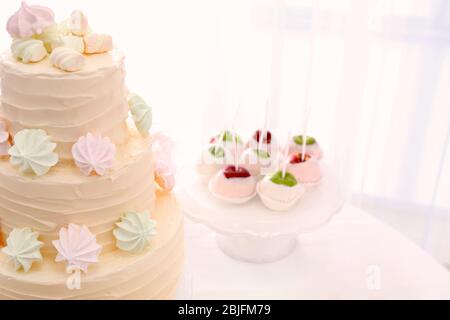 Tasty cake and sweets served on table Stock Photo
