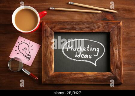 Text "MARKETING IDEAS" written on chalkboard Stock Photo