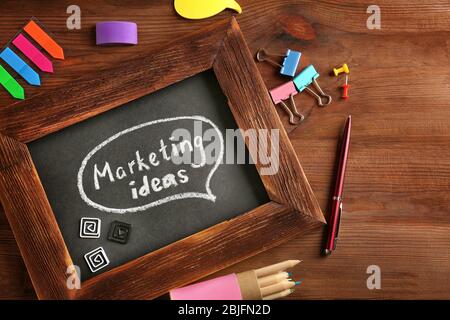Text "MARKETING IDEAS" written on chalkboard Stock Photo