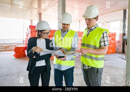 Group of business people at construction site Stock Photo