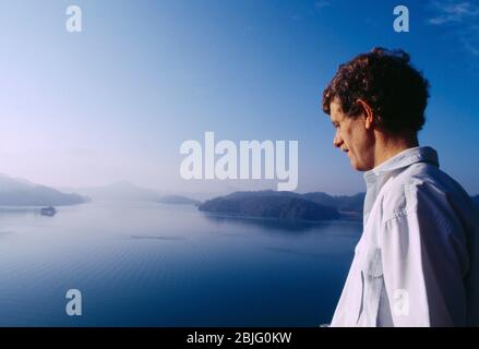 Taipei Taiwan Tourist Looking over Sun Moon Lake at Dawn Stock Photo