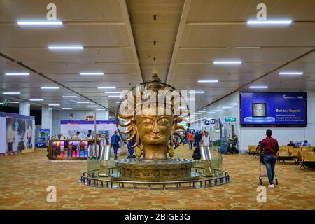 New Delhi / India - October 12, 2019: Statue of Buddha head at Terminal 3 Departures Hall of Indira Gandhi International Airport Stock Photo