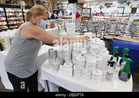 St. Louis, United States. 29th Apr, 2020. Clerk Donna Cox stacks toilet paper onto a table at LeGrand's Market in St. Louis on Wednesday, April 29, 2020. Photo by Bill Greenblatt/UPI Credit: UPI/Alamy Live News Stock Photo