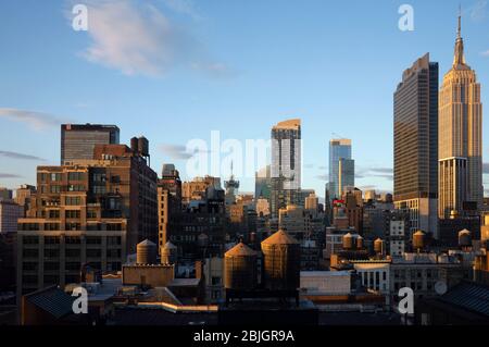 View across the rooftops of midtown, Manhattan towards skyscrapers Stock Photo