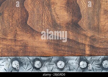 punched medieval belt on a wood background with space for text background with space for text Stock Photo