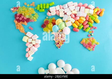Map of world made from different candies on blue background Stock Photo
