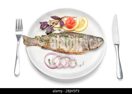 Plate with tasty fried fish and cutlery set on white background Stock Photo