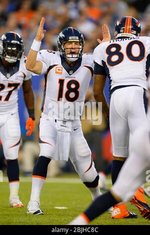 NFL quarterback Peyton Manning reacts to his missed putt on the 18th ...