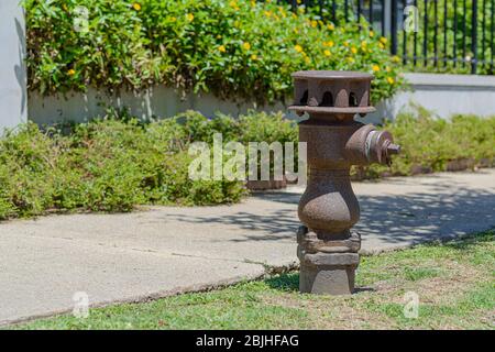 Oldest Fire Hydrant in New Orleans, installed 9/14/1869, across from Bayou St. John at the corner of Grand Route St. John and Moss Street Stock Photo