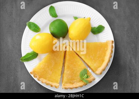 Pieces of homemade lemon tart on plate Stock Photo