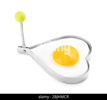 Cooking of delicious sunny side up egg in mold Stock Photo - Alamy