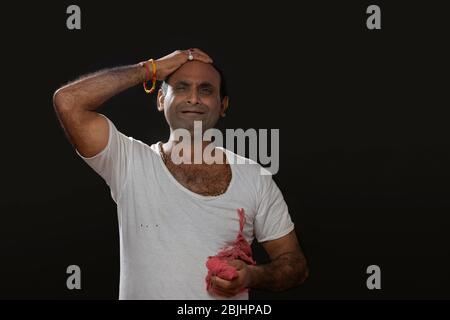 Depressed Indian farmer standing and holding his head in disbelief ...