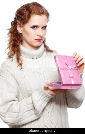 Sad girl with in cashmere sweater a gift isolated on white background Stock Photo