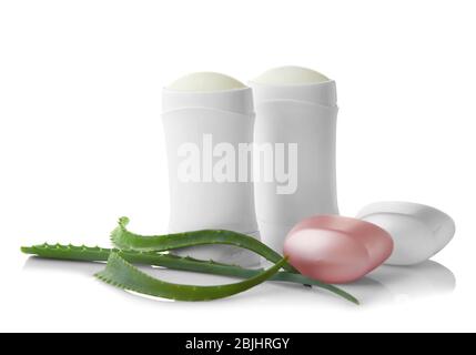 Deodorants and aloe leaves isolated on white Stock Photo