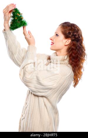 Beautiful girl in cashmere sweater with a Christmas toy  isolated on white background Stock Photo