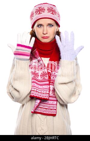 Sad woman in gloves of different colors  isolated on white background Stock Photo