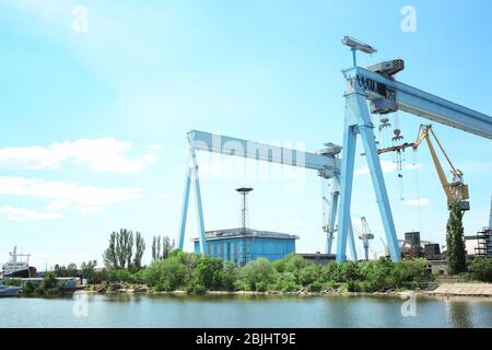 Different cranes in river port Stock Photo