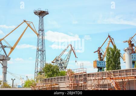 Hoisting cranes in shipyard Stock Photo