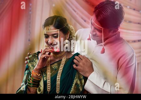 Handsome groom looking at beautiful bride Stock Photo