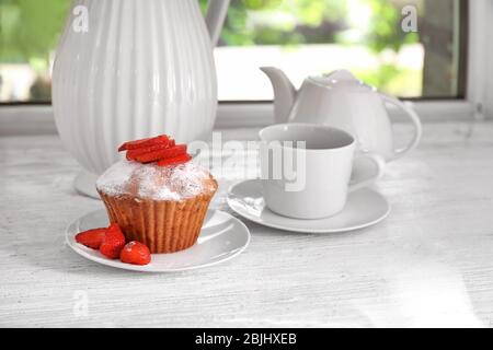 Delicious muffin on windowsill Stock Photo