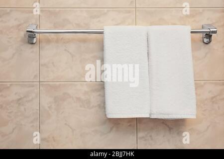 Dryer with towels in light modern bathroom Stock Photo