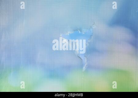 Torn window screen, closeup Stock Photo