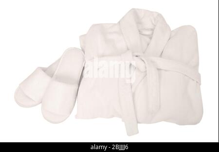 Folded bathrobe and bathing slippers on white background Stock Photo